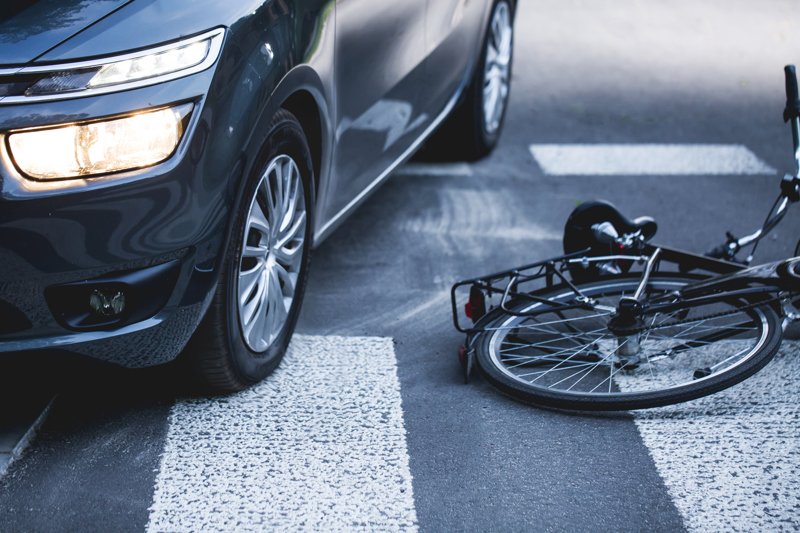 An accident between a bicycle and car at an intersection in Montgomery.