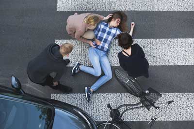 A woman lying on the ground after pedestrian accident 