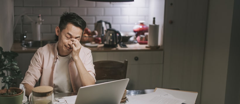 Image of man on his laptop computer.