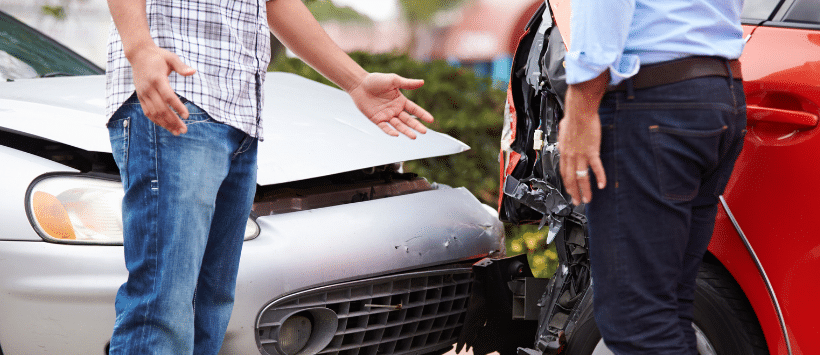 Image of two drivers arguing after a car collision